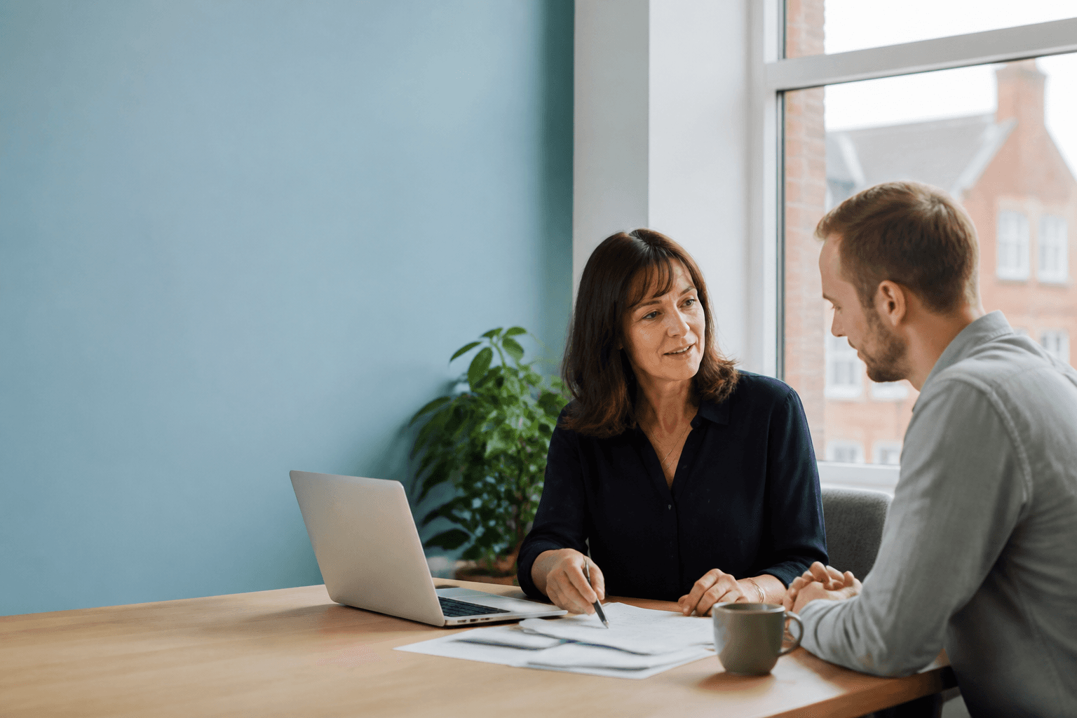 An accountant talking through paperwork with a client
